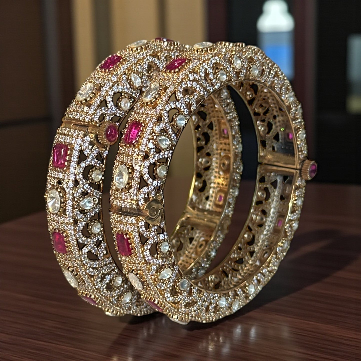 Handcrafted gold-tone kundan bangle with ruby and polki stones for Indian bridal wear