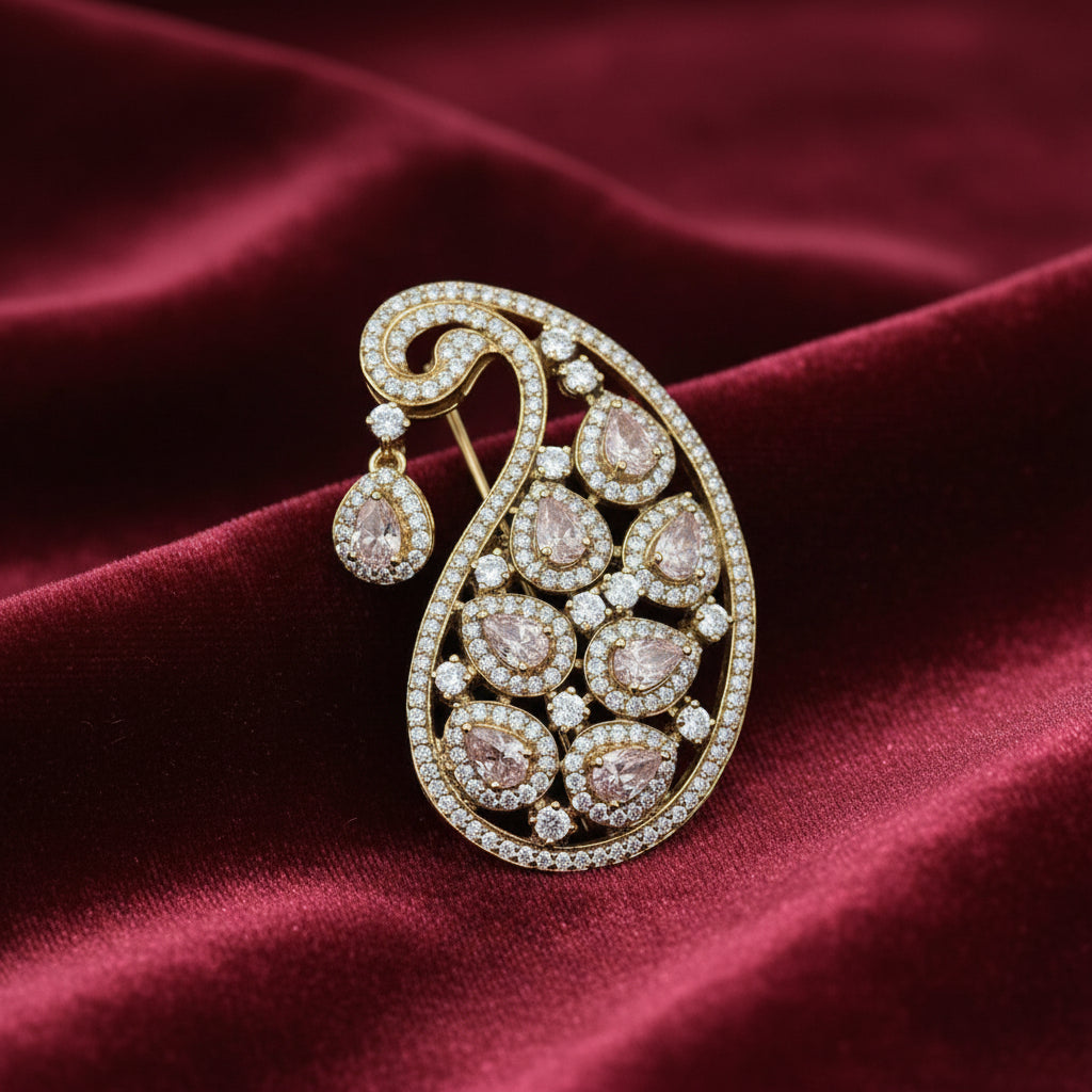 Ornate brooch on an open book with dried flowers